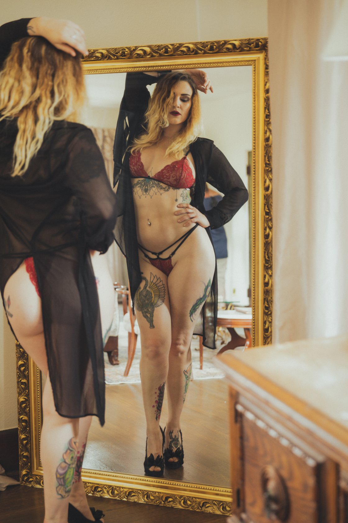 woman in mirror in red lingerie